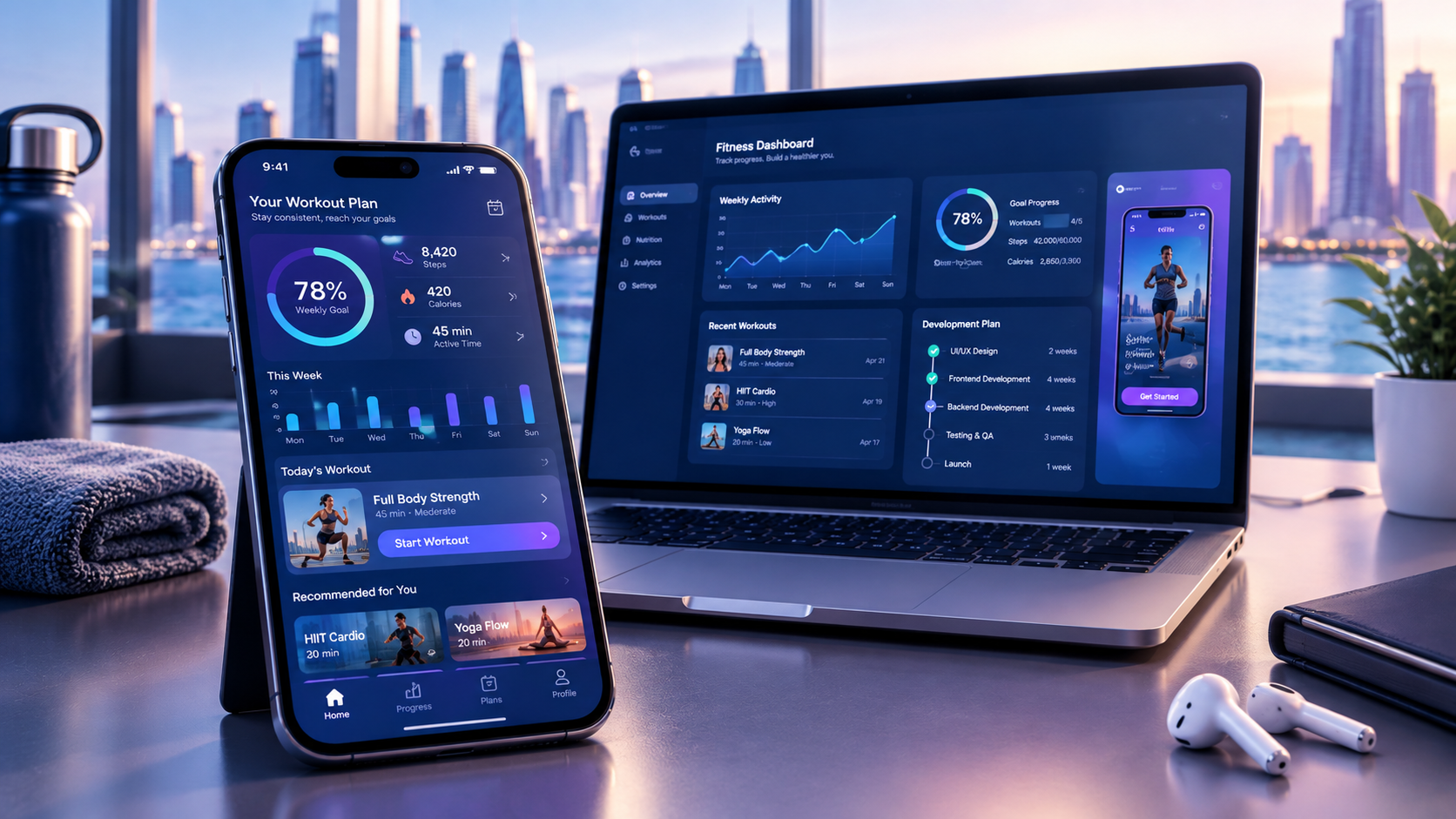 Fitness app displayed on a smartphone beside a laptop showing workout tracking, activity statistics, and fitness analytics.